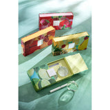 Détail du coffret J-Line - Huile parfumée Fraise Daiquiri sur une table chic