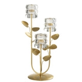 Bougeoir J-Line Branch Leaf sur une table, ambiance chaleureuse