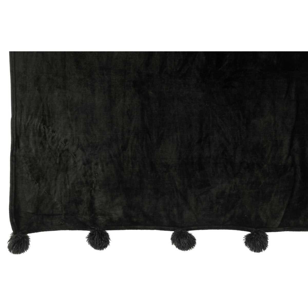 Ambiance salon avec plaid noir J-Line sur fauteuil
