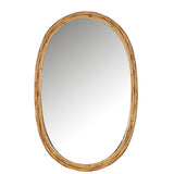 Miroir ovale J-Line accroché dans un salon moderne