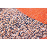 Tapis Eco Carpe Diem sur un sol en bois