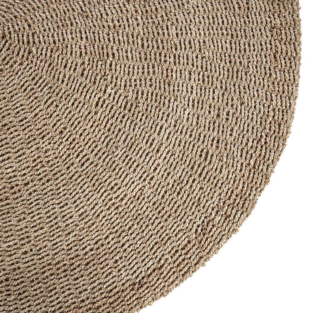Détail du tissage du tapis I'm, mettant en avant son caractère artisanal.