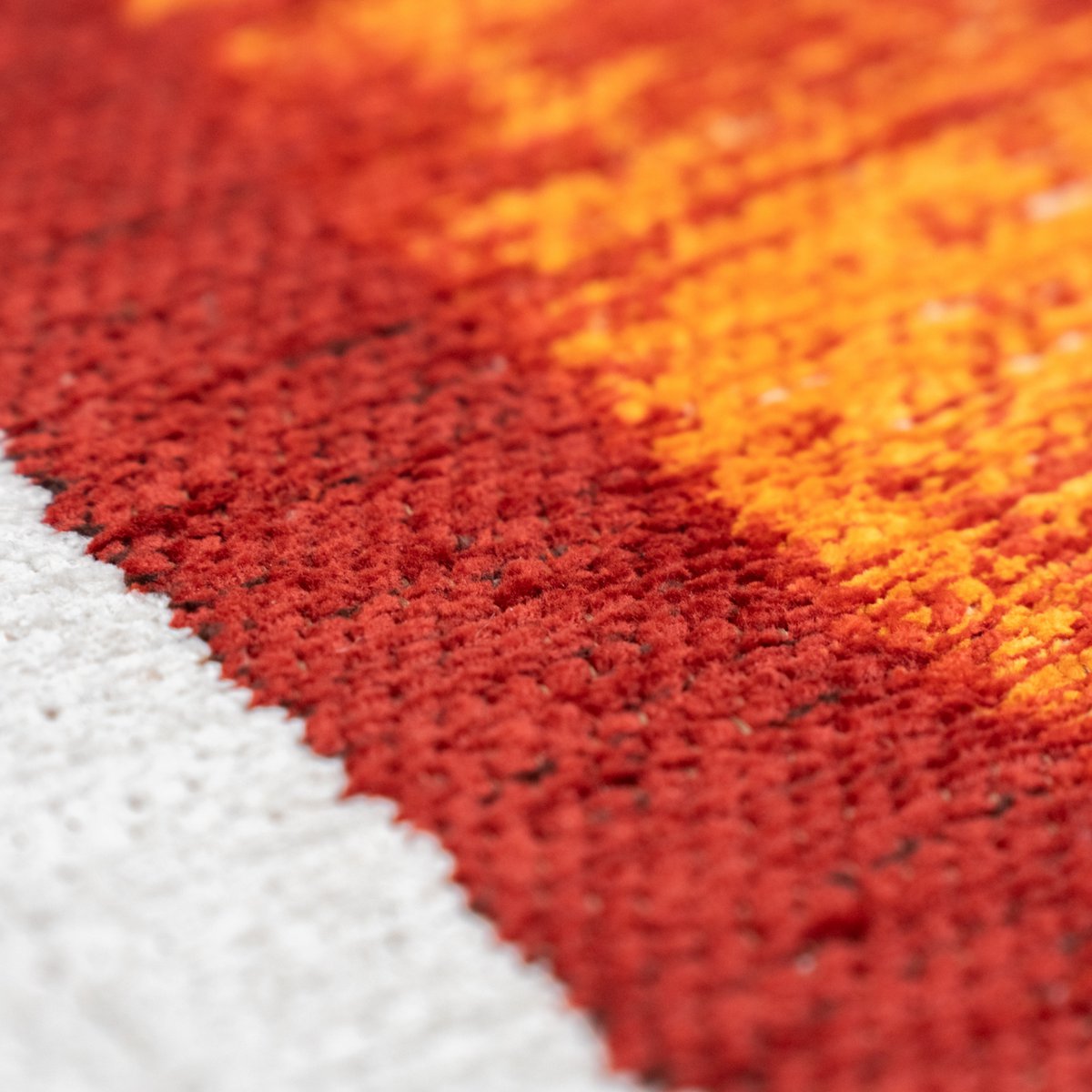 Tapis Eco orange, étiquette de la marque Louis De Poortere