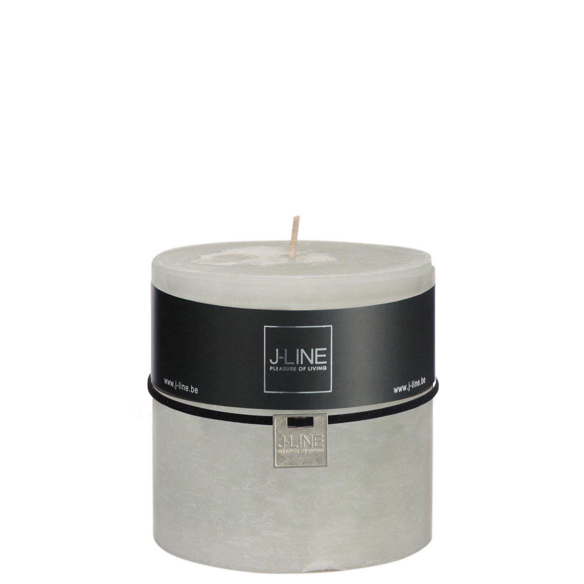 Bougie J-Line allumée, diffusant une lumière douce dans un intérieur moderne