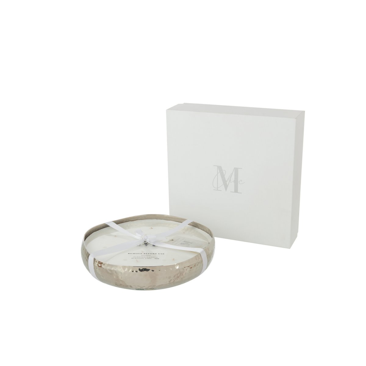 Bougie J-Line M-Chic sur une table, ambiance chaleureuse et élégante