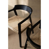 Chaise Emma en teck noir et marron dans une salle à manger