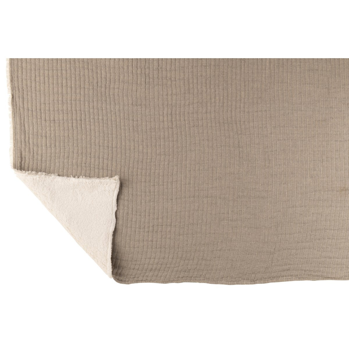 Plaid J-Line gris posé sur un lit avec coussins assortis