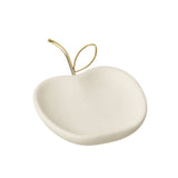 Assiette J-Line Pomme sur une table dressée, ambiance chic