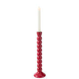 Vue latérale du bougeoir J-Line, mettant en valeur sa couleur fuschia