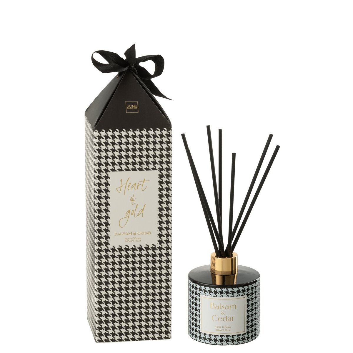 Bâtonnets parfumés J-Line Heart Of Gold sur une table moderne