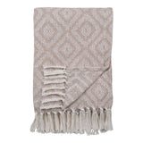 Cort Plaid en coton recyclé ivoire et beige sur un canapé