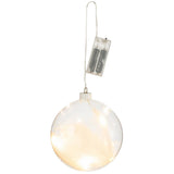 Boule Plumes LED J-Line posée sur une table, ambiance lumineuse chic