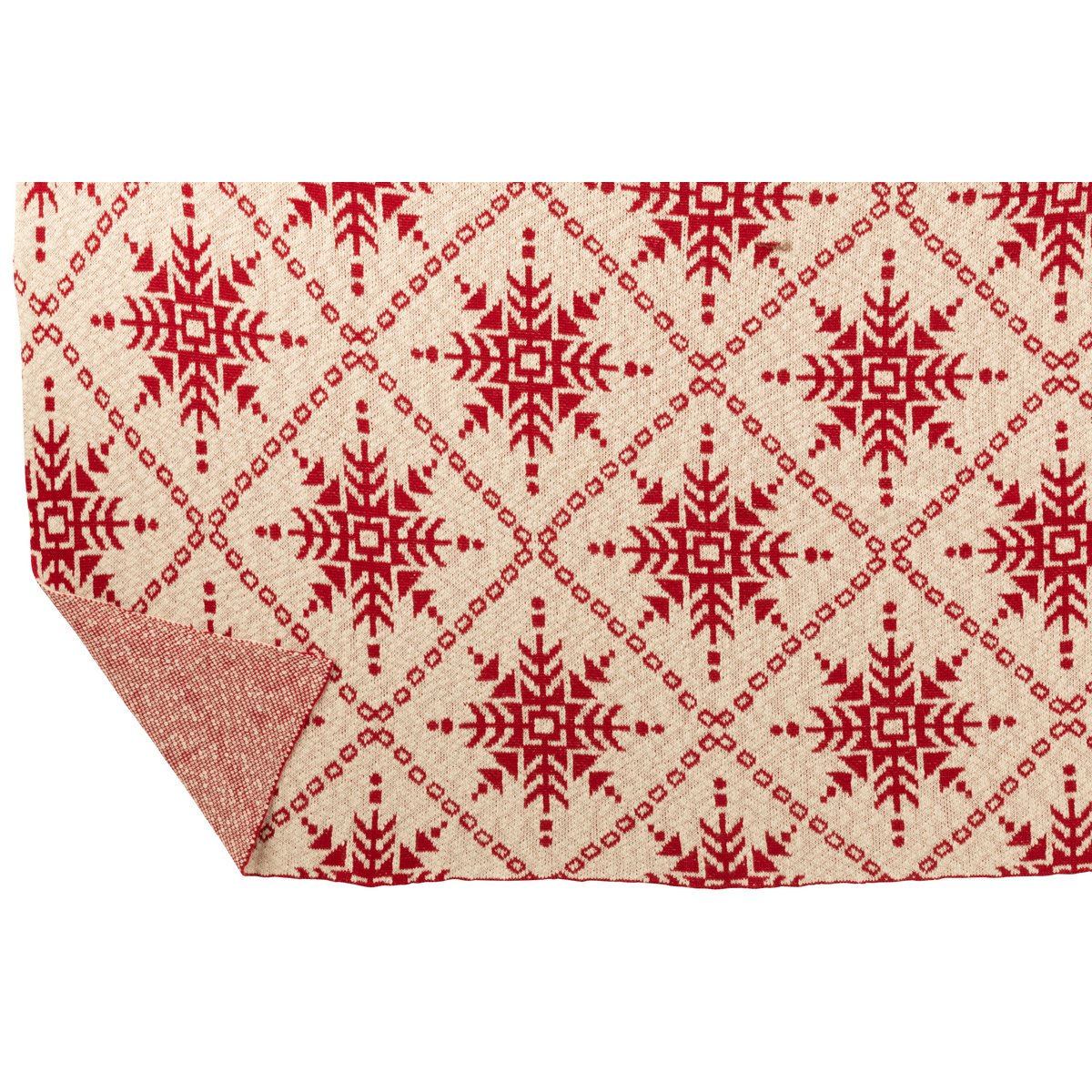 Couverture J-Line drapée sur un canapé élégant