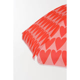 Détail du parasol Coeur Rose, vue sur le mât en acier et le tissu en polyester