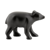 Vue latérale de la statue ours en céramique noire, minimaliste