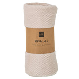 Couverture J-Line Snuggle drapée sur un canapé moderne
