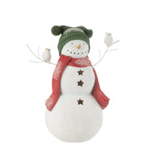 Figurine bonhomme de neige J-Line sur une table décorée pour Noël.