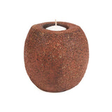 Bougeoir Cavestone en terre cuite sur une table décorée