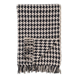 Plaid noir et beige en coton recyclé sur canapé