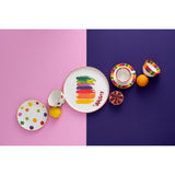 Assiette J-Line Stripe sur une table élégamment dressée