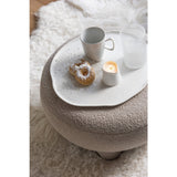 Tabouret rond Teddy utilisé comme table basse