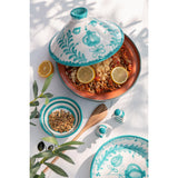 Tajine Grenade J-Line en céramique sur une table élégante.