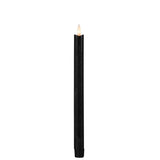 Vue rapprochée des bougies LED noires, texture cire authentique