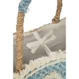 Sac de plage J-Line posé sur une surface naturelle, mettant en valeur son style bohème