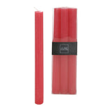 Bougies de table J-Line fuchsia, présentées dans un intérieur élégant