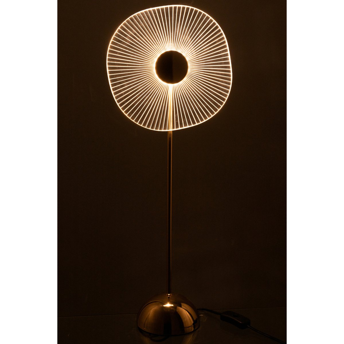 Lampe LED Fleur en métal doré sur une table de chevet