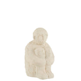 Figurine J-Line en ciment blanc, vue latérale montrant la texture mate