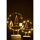 Demi-Cercle LED Père Noël sur une table de Noël décorée