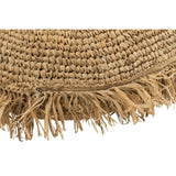 Coussin rond en raphia naturel J-Line sur canapé
