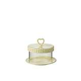 Détail du plateau de gâteau J-Line, céramique jaune, sur une table élégante