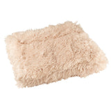 Couverture J-Line Moutie beige, vue d'ensemble sur un canapé.