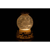 Globe décoratif J-Line sur une table en bois, ambiance chaleureuse