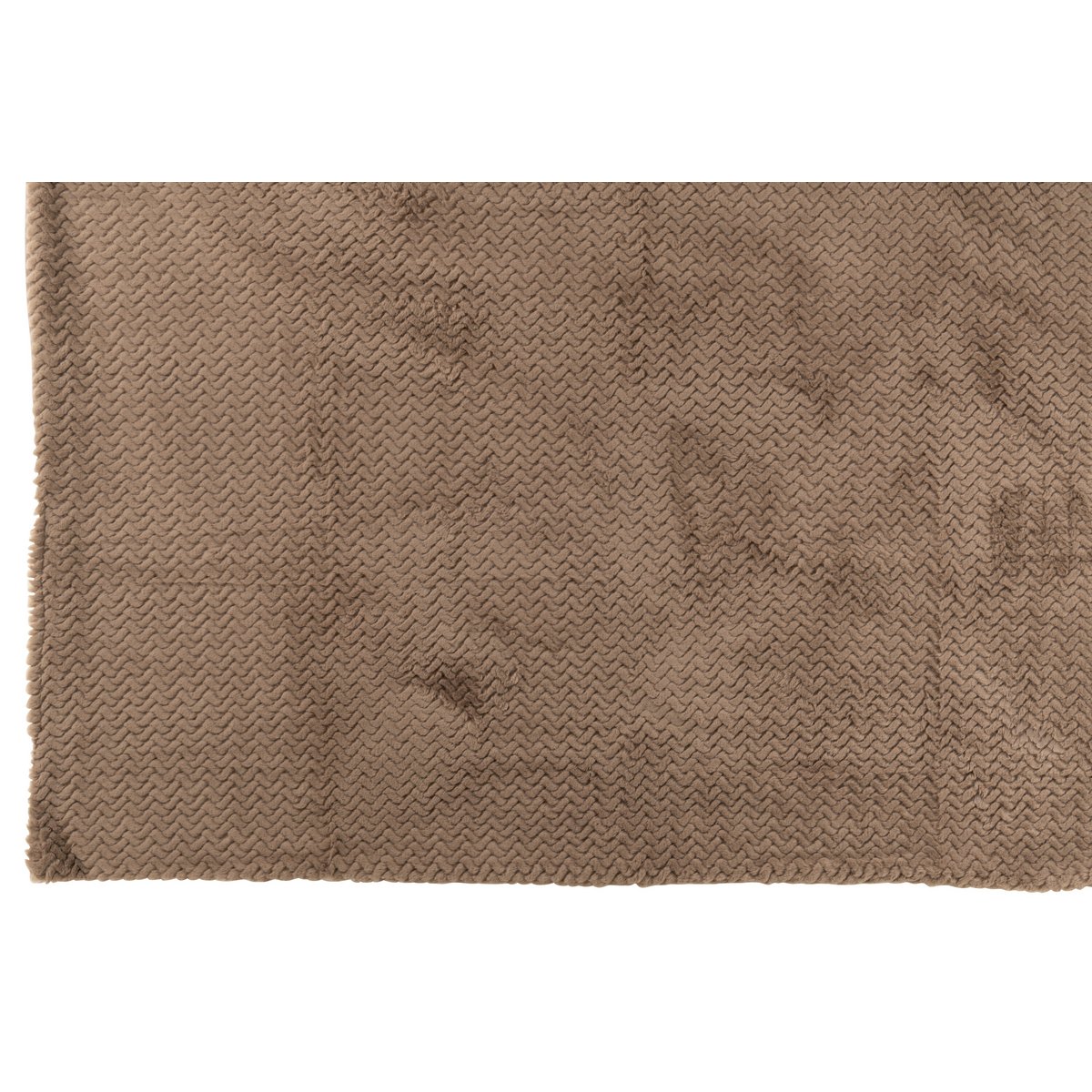 Couverture J-Line drapée sur un canapé moderne