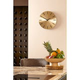 Vue d'ensemble de l'horloge Brixen Or dans un intérieur moderne