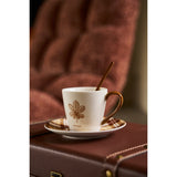 Tasses en céramique marron du coffret J-Line sur une table élégante