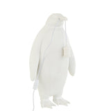 Lampe J-Line Penguin sur une table moderne en bois