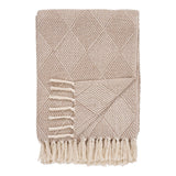 Plaid Bursa Taupe/Beige drapé sur un canapé moderne