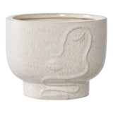 Pot de fleur en céramique beige avec design minimaliste