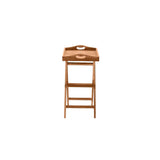 Desserte en teck utilisée comme table d'appoint dans un jardin