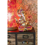 Figurine Ganesha sur une table, ajoutant une touche décorative