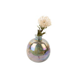 Vase Mélange Bouteille en verre vert, détail de la texture et de la finition.