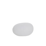 Lampe extérieure LED J-Line blanche sur fond de jardin verdoyant