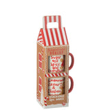 Boîte décorative J-Line en céramique rouge, mise en scène dans un salon élégant.