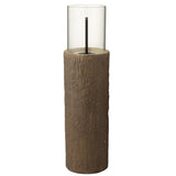 Brasero J-Line Trunk Round allumé, créant une ambiance chaleureuse en extérieur