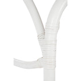 Tabouret à roulettes J-Line en rotin blanc, dans un salon moderne