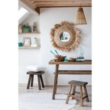 Tapis rond J-Line beige sur un parquet